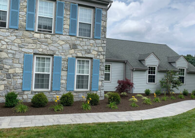 Paver Walkway, Mulch Beds with seasonal floral planting